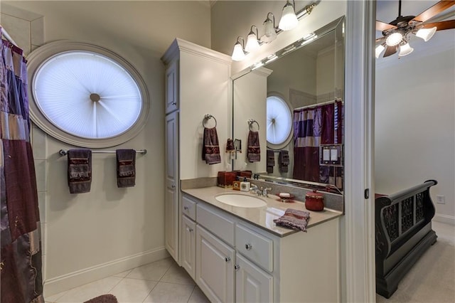 full bathroom featuring tile patterned floors, vanity, ceiling fan, baseboards, and ornamental molding