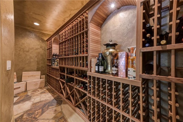 wine cellar featuring recessed lighting and stone floors