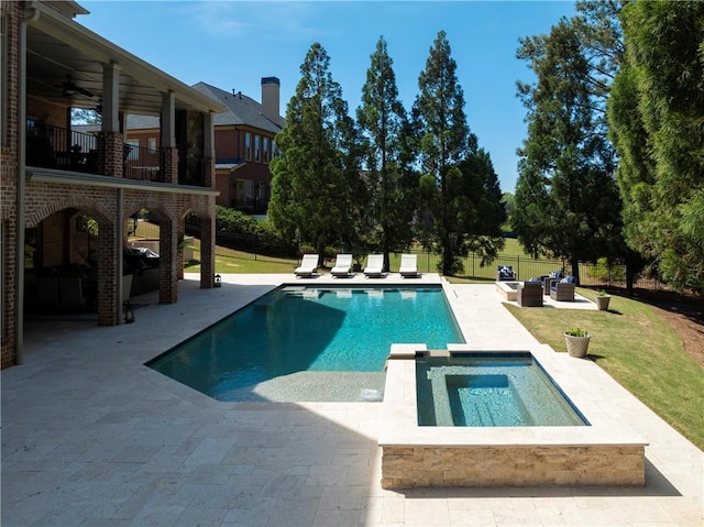 view of pool featuring a lawn, an outdoor living space, a ceiling fan, and a patio