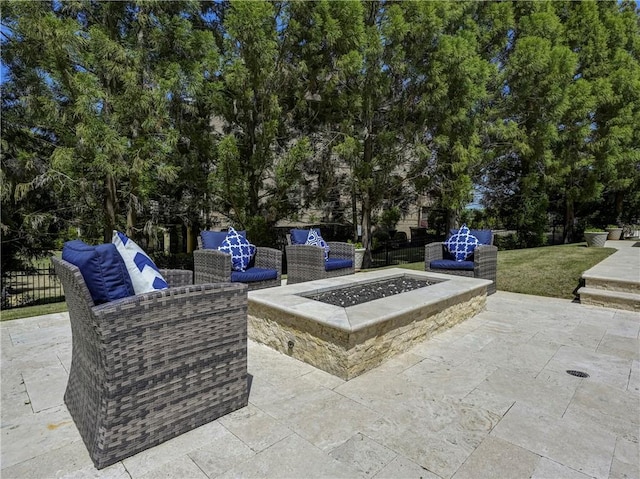 view of patio / terrace with an outdoor living space with a fire pit
