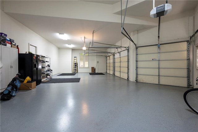 garage featuring a garage door opener