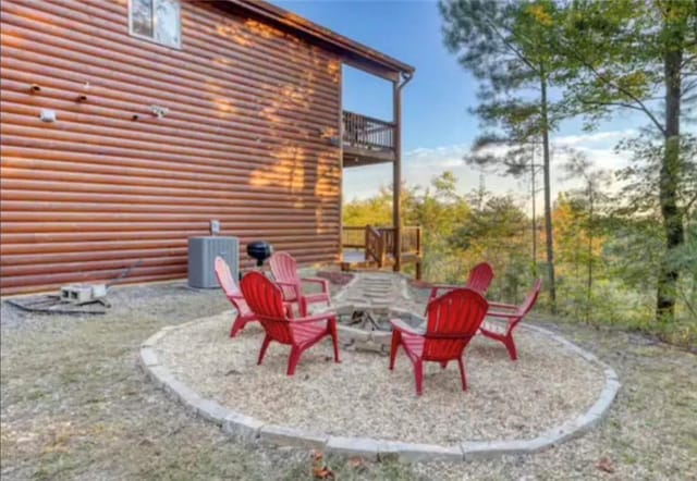 view of patio with a fire pit and cooling unit