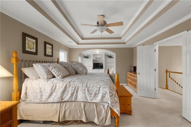 bedroom with a raised ceiling, ornamental molding, light carpet, and ceiling fan