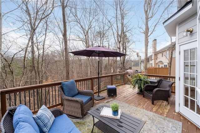 wooden terrace featuring an outdoor hangout area