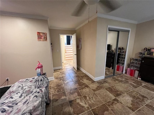 hall with dark tile patterned flooring and ornamental molding