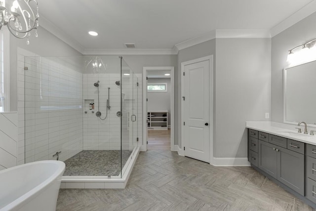 4781 Falling Brook Dr, Flowery Branch, GA 30542 - bathroom with a stall shower, a freestanding tub, vanity, ornamental molding, and baseboards