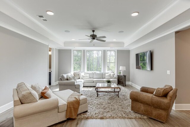 4781 Falling Brook Dr, Flowery Branch, GA 30542 - living room with a tray ceiling, a ceiling fan, plenty of natural light, and recessed lighting