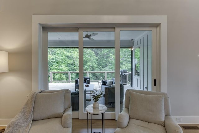 4781 Falling Brook Dr, Flowery Branch, GA 30542 - living area featuring baseboards, wood finished floors, and ceiling fan