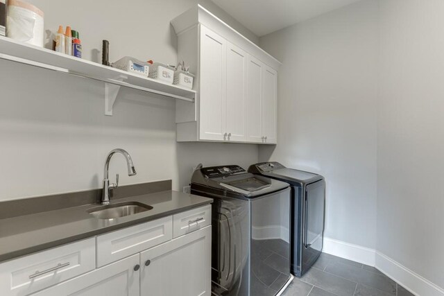 4781 Falling Brook Dr, Flowery Branch, GA 30542 - laundry area featuring cabinet space, separate washer and dryer, baseboards, and dark tile patterned flooring