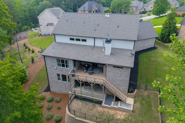 4781 Falling Brook Dr, Flowery Branch, GA 30542 - back of property featuring a patio, a shingled roof, and a wooden deck