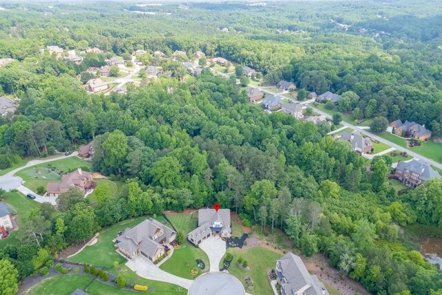 4781 Falling Brook Dr, Flowery Branch, GA 30542 - aerial view of property and surrounding area with a heavily wooded area and nearby suburban area