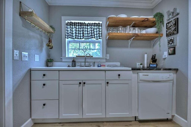 kitchen featuring ornamental molding, white dishwasher, white cabinetry, and sink