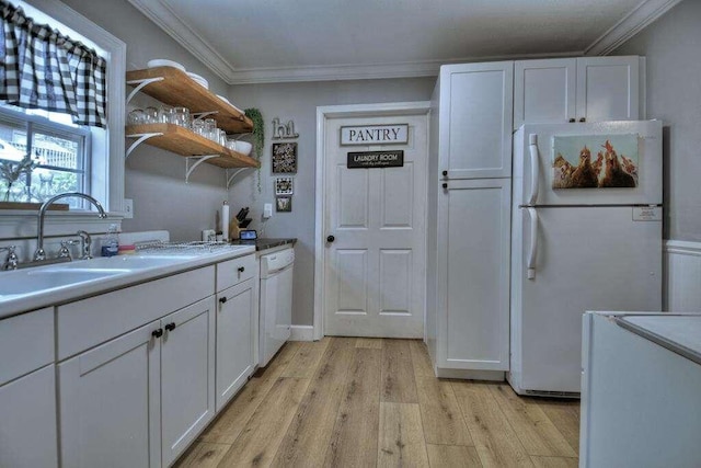 kitchen featuring light wood-type flooring, white appliances, white cabinetry, and crown molding