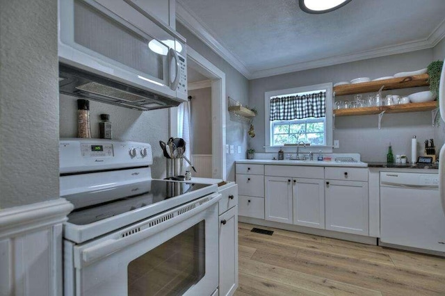 kitchen featuring light hardwood / wood-style floors, sink, white cabinetry, white appliances, and ornamental molding