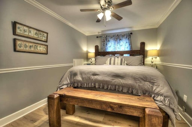 bedroom featuring crown molding, ceiling fan, and hardwood / wood-style flooring