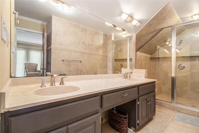 1935 Northbrooke Ln, Dunwoody, GA 30338 - full bath with double vanity, a stall shower, crown molding, tile patterned flooring, and tile walls