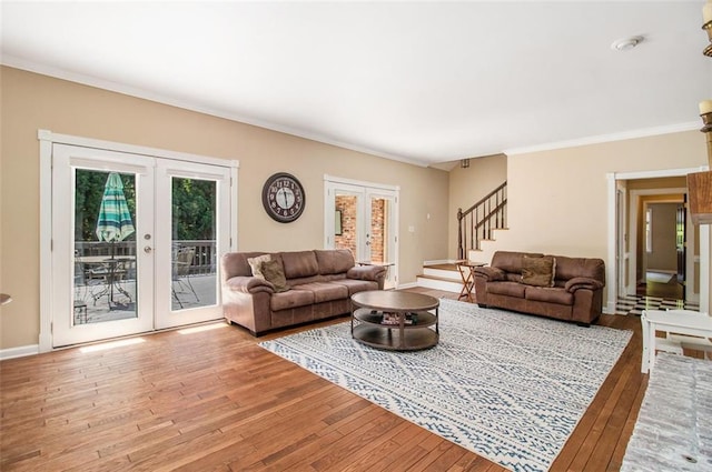 1935 Northbrooke Ln, Dunwoody, GA 30338 - living room with french doors, wood finished floors, plenty of natural light, stairs, and ornamental molding