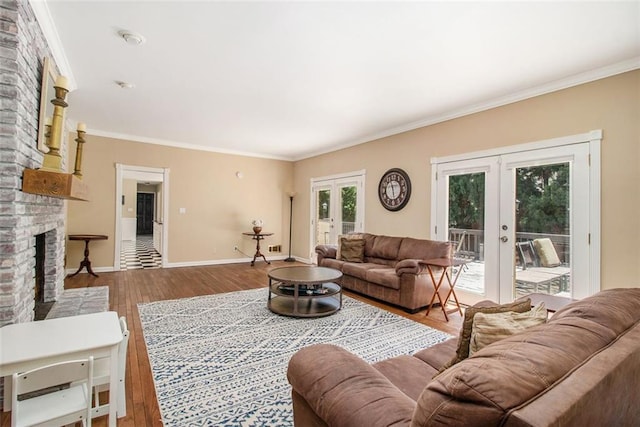 1935 Northbrooke Ln, Dunwoody, GA 30338 - living area featuring french doors, a fireplace, crown molding, baseboards, and wood finished floors