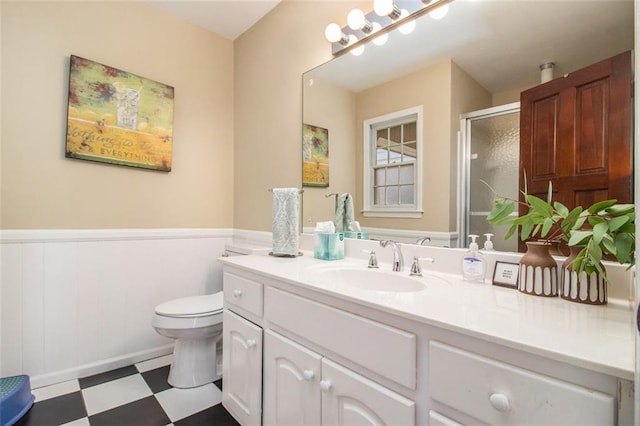 1935 Northbrooke Ln, Dunwoody, GA 30338 - full bathroom with tile patterned floors, wainscoting, toilet, a stall shower, and vanity