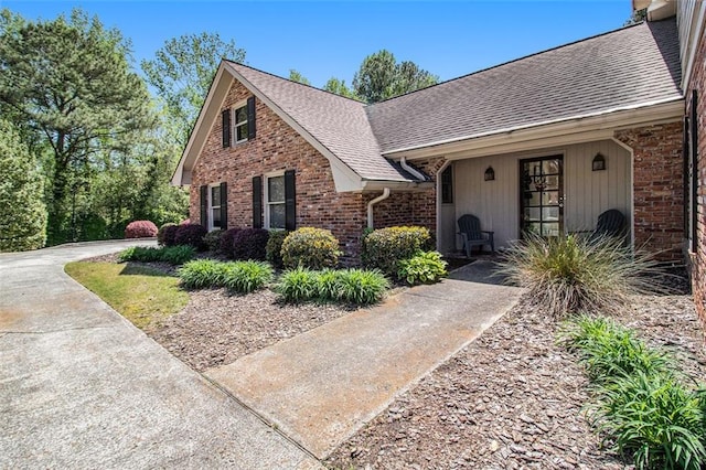 1935 Northbrooke Ln, Dunwoody, GA 30338 - view of front of home with a shingled roof and brick siding