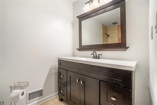 1935 Northbrooke Ln, Dunwoody, GA 30338 - full bathroom featuring vanity, baseboards, and wood finished floors
