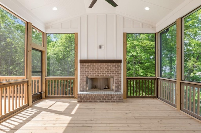 4525 Aiden Way, Cumming, GA 30041 - unfurnished sunroom featuring a brick fireplace, vaulted ceiling, and a ceiling fan