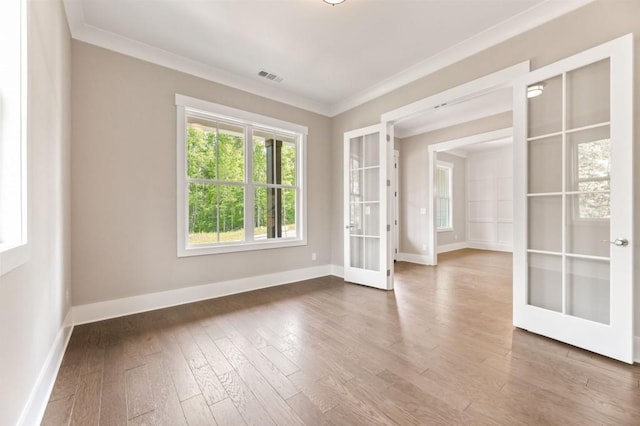 4525 Aiden Way, Cumming, GA 30041 - empty room featuring french doors, ornamental molding, and wood finished floors