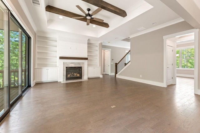 4525 Aiden Way, Cumming, GA 30041 - unfurnished living room with a ceiling fan, a fireplace, dark wood-style flooring, built in shelves, and stairs