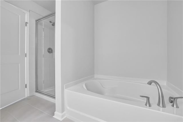 bathroom with tile patterned floors and separate shower and tub