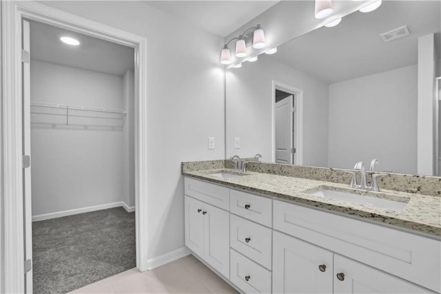 bathroom with vanity and tile patterned floors