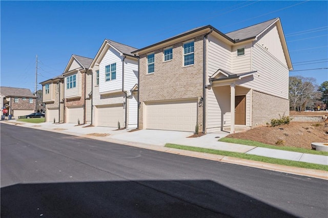 townhome / multi-family property featuring a garage