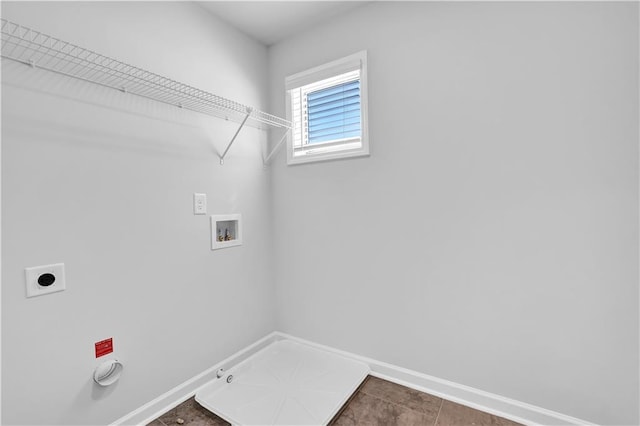 clothes washing area featuring hookup for a washing machine, gas dryer hookup, and hookup for an electric dryer