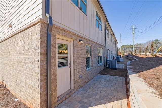 view of property exterior featuring a patio area and central air condition unit