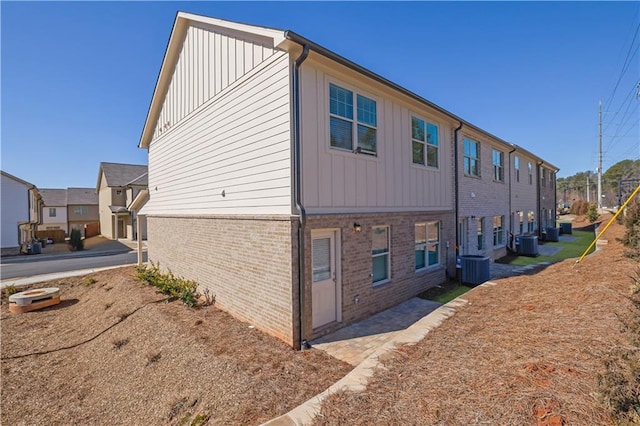 view of side of property with central AC