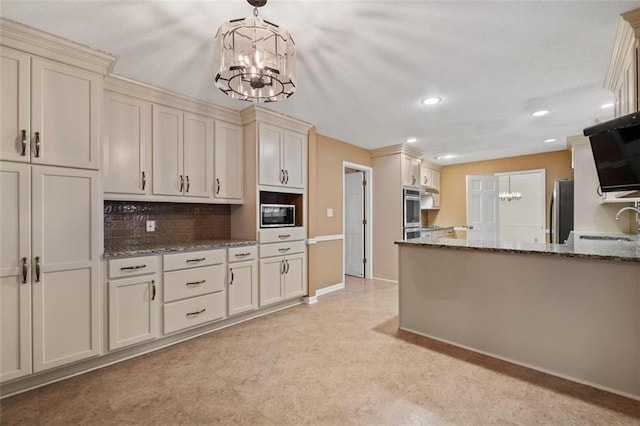 kitchen featuring a chandelier, stainless steel appliances, stone counters, and decorative backsplash