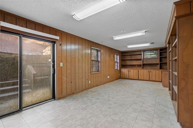 4116 River Cliff Chase SE, Marietta, GA 30067 - interior space featuring wooden walls, visible vents, and a textured ceiling