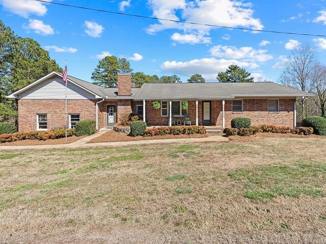 120 Semi Circle Dr, Demorest, GA 30535 - ranch-style home featuring a front lawn, a chimney, covered porch, and brick siding