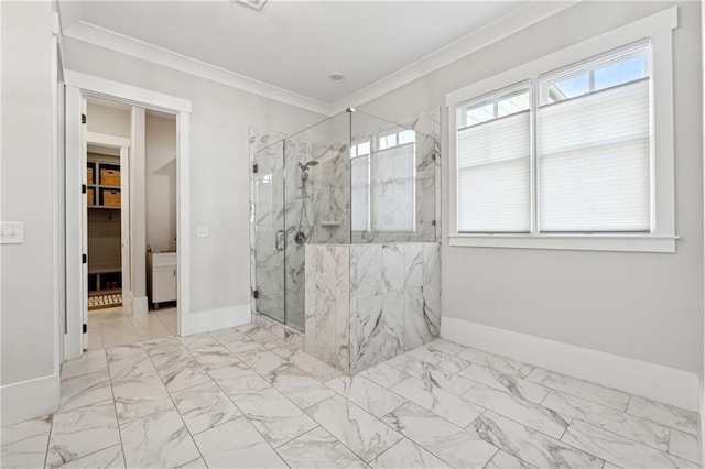 bathroom with a shower with door, plenty of natural light, and ornamental molding