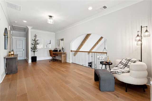 hallway featuring hardwood / wood-style flooring, a chandelier, and ornamental molding