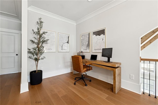 home office featuring crown molding and hardwood / wood-style floors