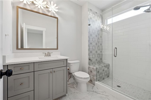 bathroom with walk in shower, vanity, and toilet