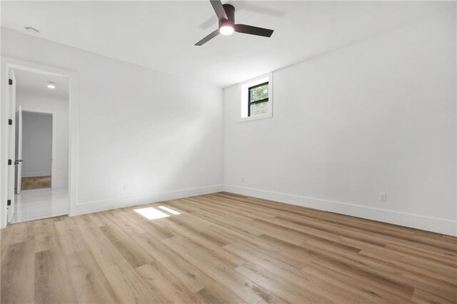 5175 Cascade Rd, Atlanta, GA 30331 - spare room featuring light wood-style floors, a ceiling fan, and baseboards