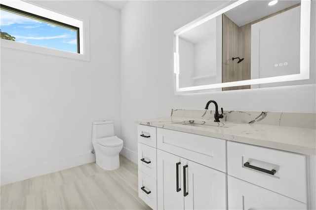 5175 Cascade Rd, Atlanta, GA 30331 - bathroom with baseboards, toilet, and vanity