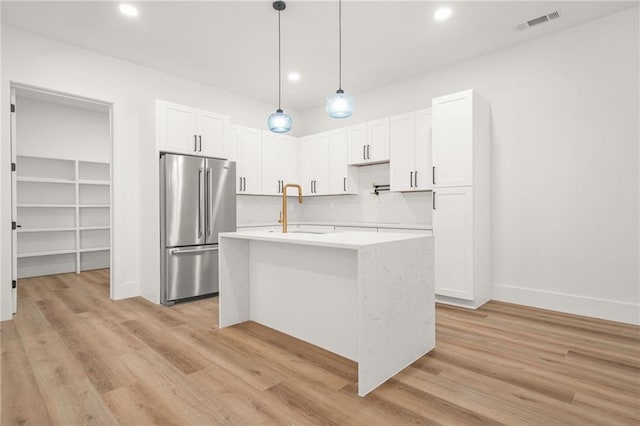 5175 Cascade Rd, Atlanta, GA 30331 - kitchen featuring freestanding refrigerator, light countertops, light wood-style flooring, a sink, and recessed lighting
