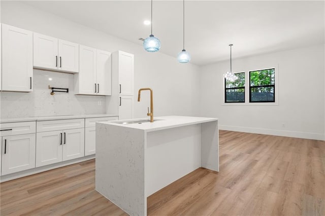 5175 Cascade Rd, Atlanta, GA 30331 - kitchen featuring a sink, white cabinetry, light countertops, and light wood-type flooring