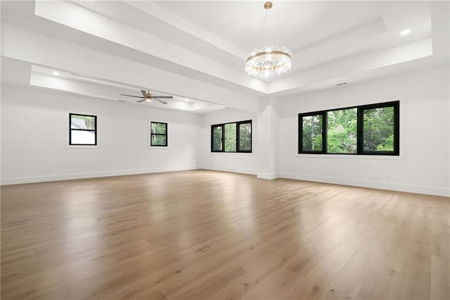 5175 Cascade Rd, Atlanta, GA 30331 - empty room featuring a tray ceiling, light wood-style floors, a chandelier, recessed lighting, and baseboards