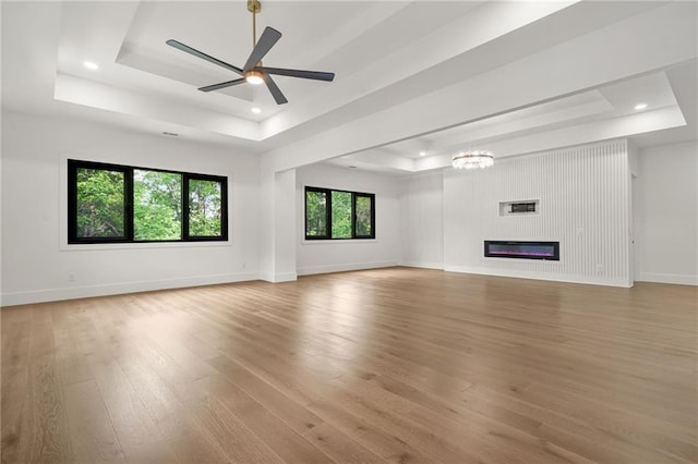 5175 Cascade Rd, Atlanta, GA 30331 - unfurnished living room with a raised ceiling, light wood-style flooring, baseboards, a ceiling fan, and recessed lighting