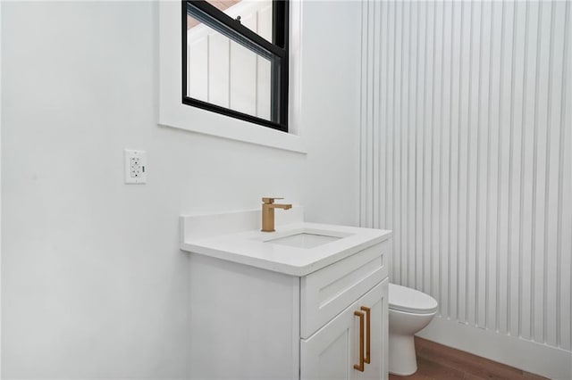 5175 Cascade Rd, Atlanta, GA 30331 - bathroom featuring toilet, wood finished floors, and vanity