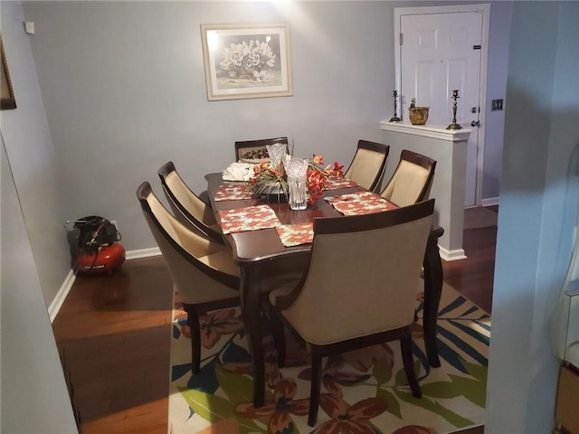 dining space featuring wood-type flooring