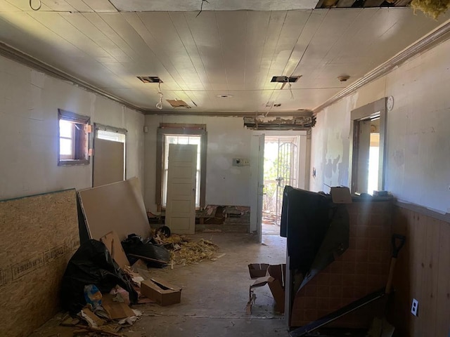 1111 Hartley St, Macon, GA 31206 - misc room with crown molding and concrete floors